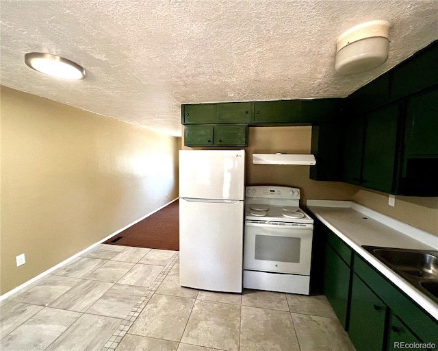 kitchen with a textured ceiling, white appliances, green cabinets, and exhaust hood