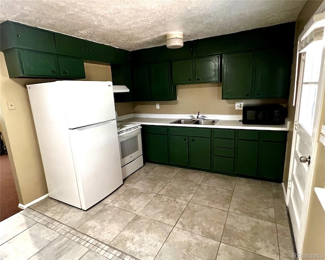 kitchen with electric range oven, a textured ceiling, sink, green cabinetry, and white fridge