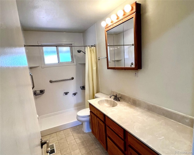 bathroom with a shower with curtain, tile patterned flooring, vanity, and toilet