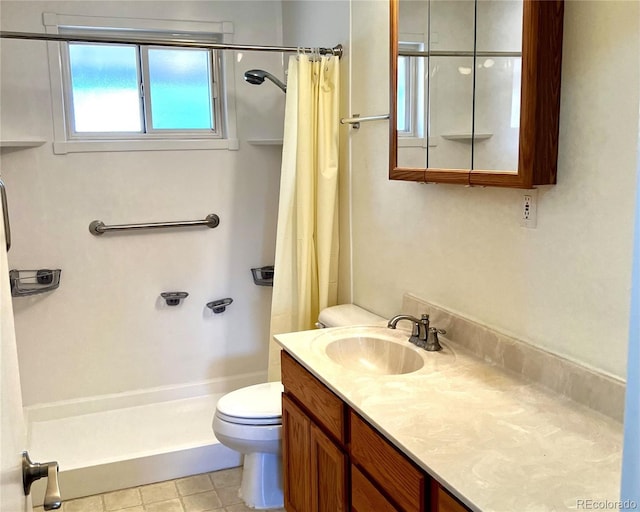 bathroom featuring walk in shower, vanity, and toilet