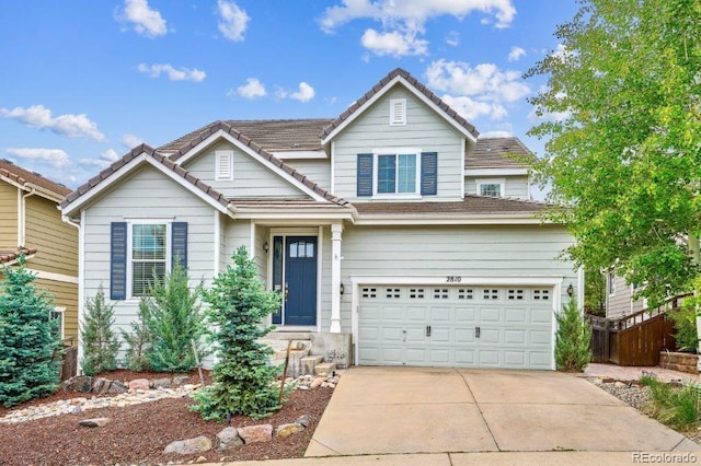 2810 Shadow Dance Dr, Castle Rock, CO 80109 - traditional home with concrete driveway, a garage, and a tiled roof