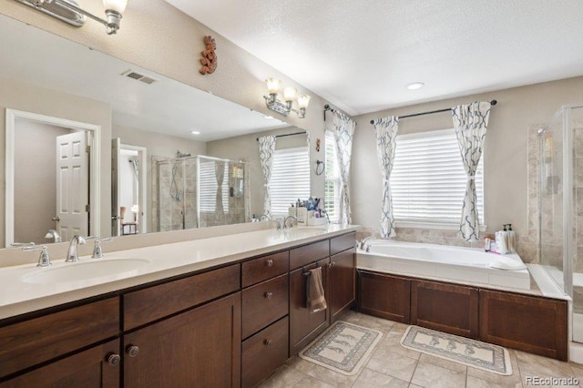 2810 Shadow Dance Dr, Castle Rock, CO 80109 - bathroom with a shower stall, double vanity, a bath, and tile patterned floors