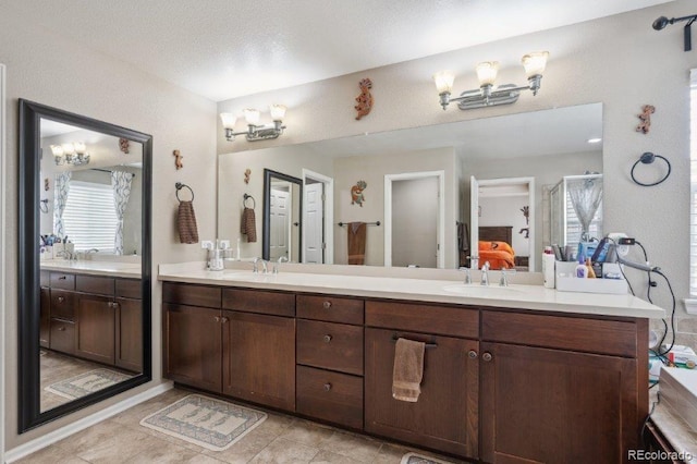 2810 Shadow Dance Dr, Castle Rock, CO 80109 - bathroom featuring double vanity, tile patterned flooring, a shower, and ensuite bath