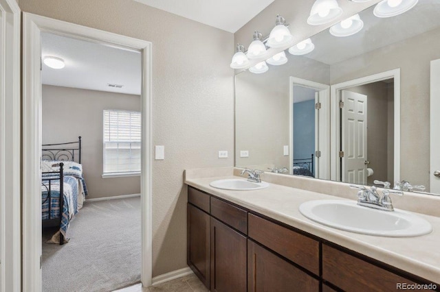 2810 Shadow Dance Dr, Castle Rock, CO 80109 - ensuite bathroom featuring double vanity, toilet, and baseboards