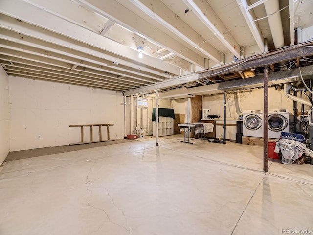 basement featuring washing machine and clothes dryer