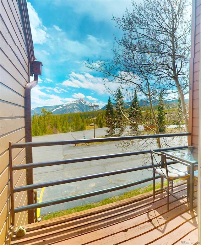 wooden deck featuring a mountain view