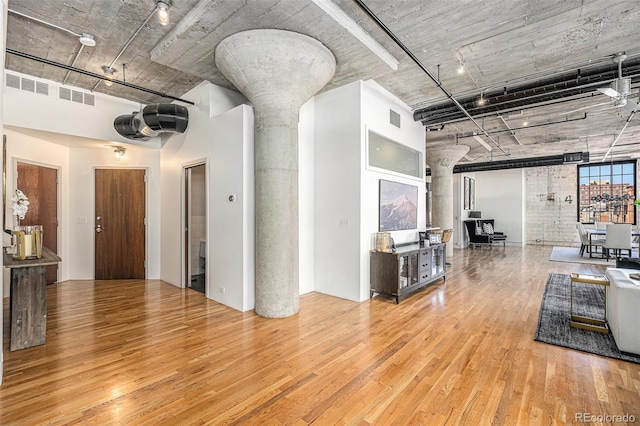 1863 Wazee St Unit 4E, Denver, CO 80202 - living area with hardwood / wood-style flooring and ornate columns