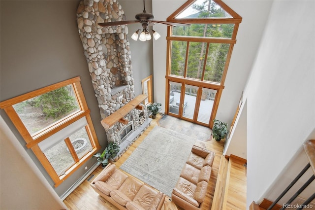 30 Carroll Ct, Black Hawk, CO 80422 - entryway featuring a high ceiling, a glass covered fireplace, wood finished floors, and ceiling fan