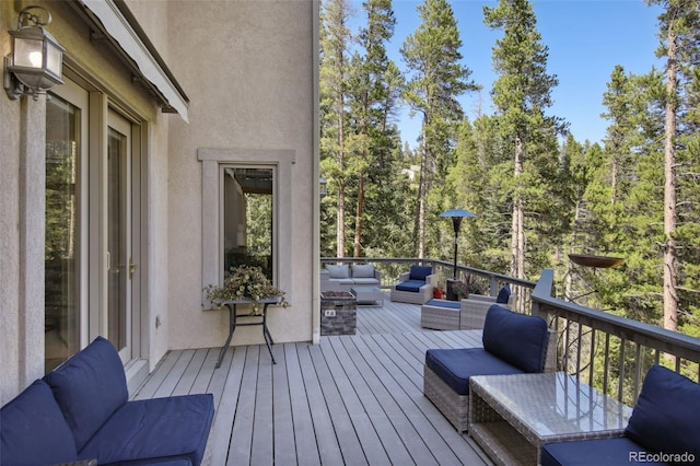 30 Carroll Ct, Black Hawk, CO 80422 - wooden terrace with an outdoor living space with a fire pit