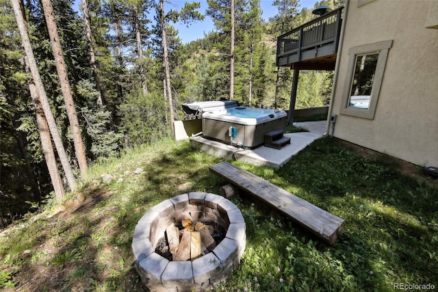 30 Carroll Ct, Black Hawk, CO 80422 - view of yard with a fire pit, a balcony, a hot tub, and a forest view