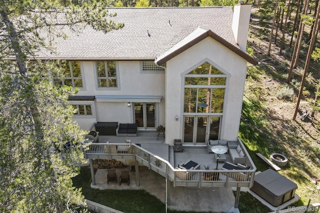 30 Carroll Ct, Black Hawk, CO 80422 - rear view of property with an outdoor hangout area, a wooden deck, stucco siding, and a chimney