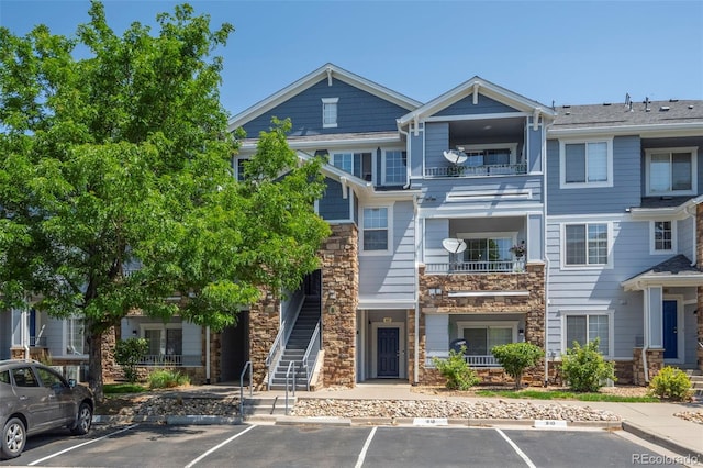 5255 Memphis St Unit 811, Denver, CO 80239 - view of property with uncovered parking and stairs
