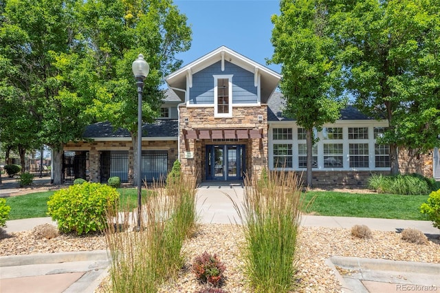 5255 Memphis St Unit 811, Denver, CO 80239 - view of front of house with stone siding and french doors
