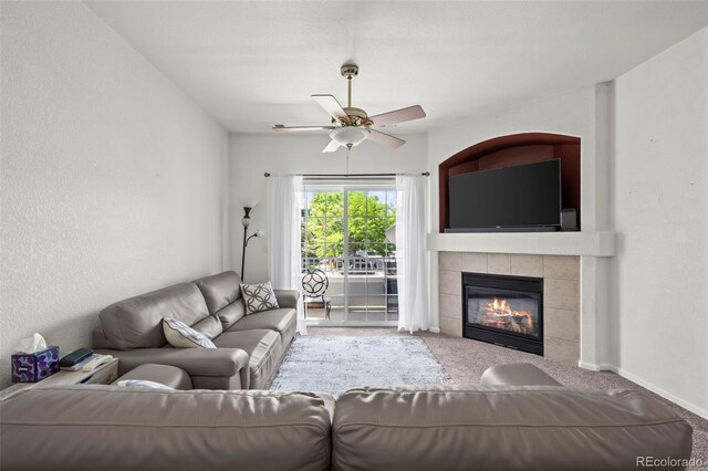 5255 Memphis St Unit 811, Denver, CO 80239 - living area with carpet, a ceiling fan, and a tile fireplace