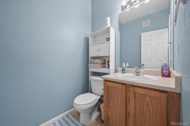 5255 Memphis St Unit 811, Denver, CO 80239 - half bathroom featuring vanity, a textured wall, and tile patterned floors