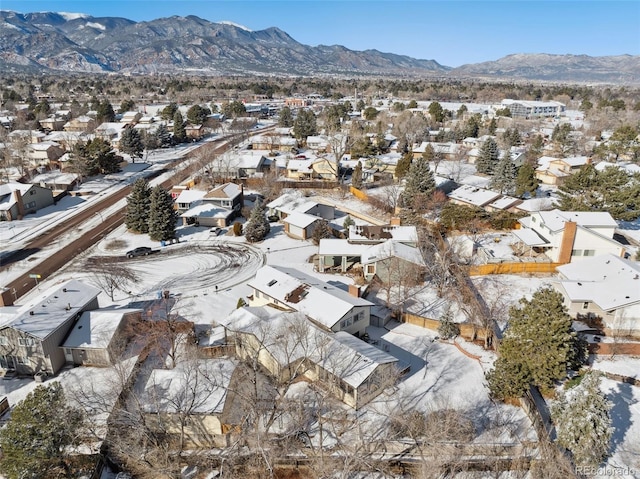 snowy aerial view featuring a mountain view