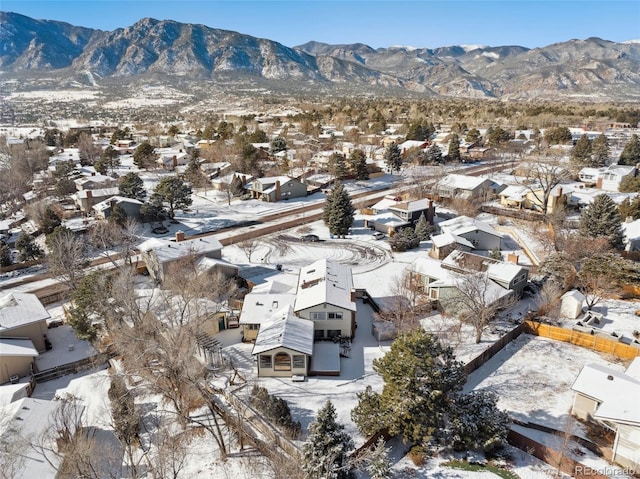 snowy aerial view featuring a mountain view