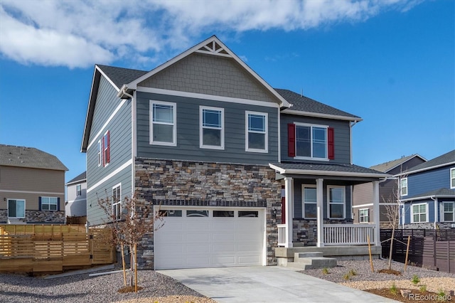 27664 E Byers Ave, Aurora, CO 80018 - craftsman inspired home with stone siding, covered porch, fence, and an attached garage