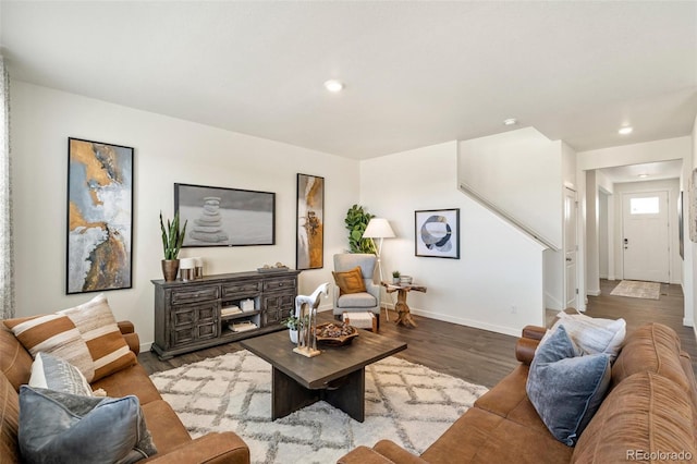 27664 E Byers Ave, Aurora, CO 80018 - living area with wood finished floors, baseboards, recessed lighting, and stairs