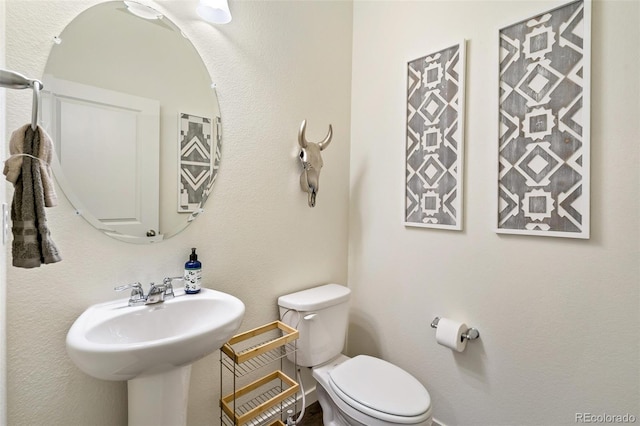 27664 E Byers Ave, Aurora, CO 80018 - bathroom with toilet and a sink