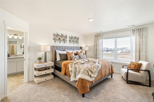 27664 E Byers Ave, Aurora, CO 80018 - bedroom featuring light carpet, ensuite bath, and baseboards