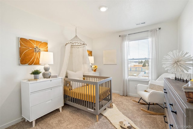 27664 E Byers Ave, Aurora, CO 80018 - bedroom with light carpet, multiple windows, baseboards, and a crib