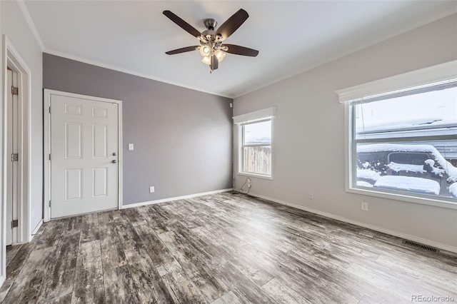 unfurnished room featuring ceiling fan, hardwood / wood-style floors, and crown molding