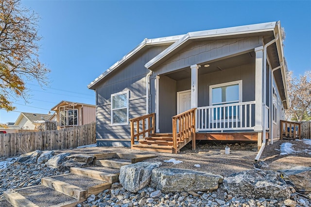 back of property featuring a porch