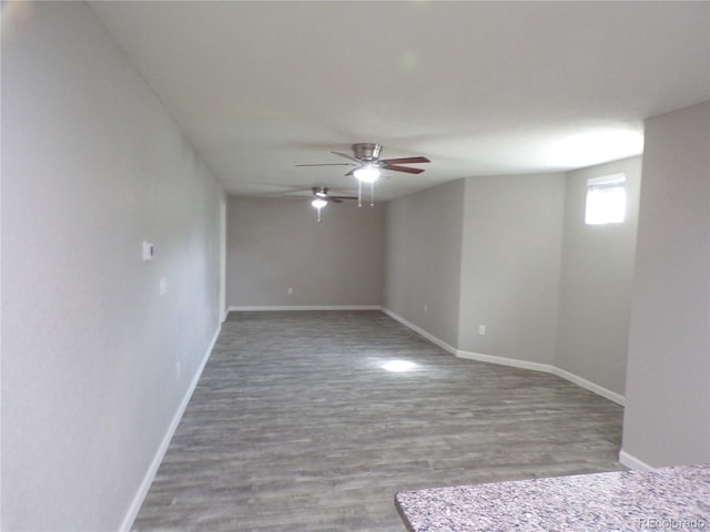 unfurnished room featuring ceiling fan and hardwood / wood-style floors