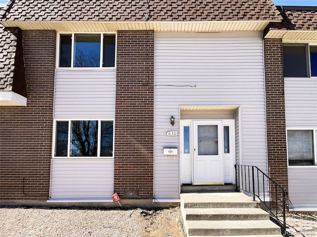 view of front of property with brick siding