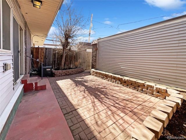 view of patio with fence