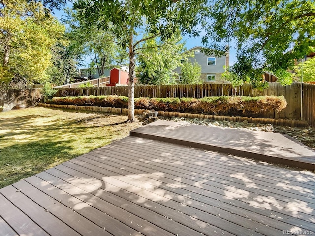 deck featuring fence and a lawn