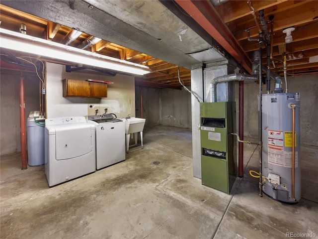 unfinished below grade area with gas water heater and independent washer and dryer