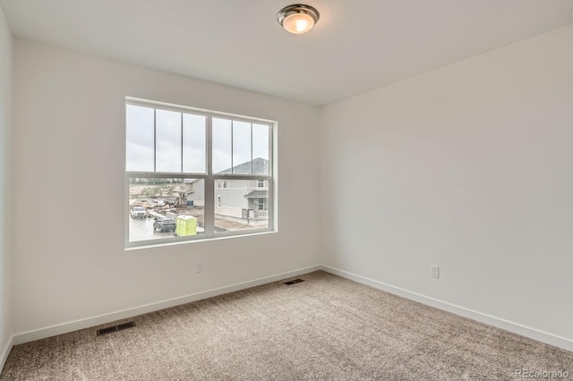 7357 S Yank Ct, Littleton, CO 80127 - spare room with carpet floors and baseboards