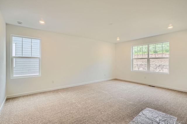 7357 S Yank Ct, Littleton, CO 80127 - unfurnished room featuring light colored carpet, baseboards, and recessed lighting