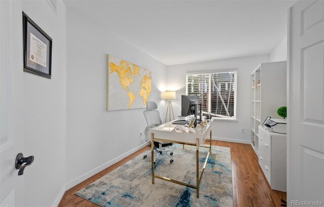 10383 Erin Pl, Lone Tree, CO 80124 - office area featuring baseboards and wood finished floors