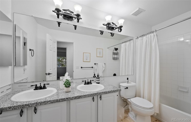full bath featuring visible vents, a sink, shower / bathtub combination with curtain, and toilet