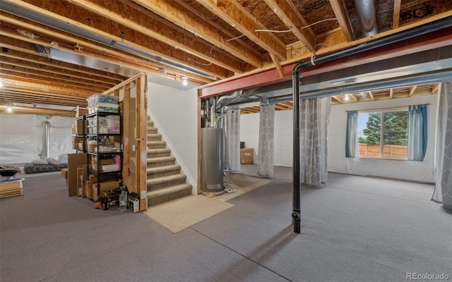 below grade area with gas water heater and stairway