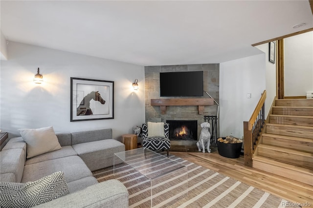 living room with a fireplace and hardwood / wood-style flooring