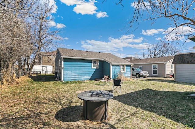 back of house featuring a yard