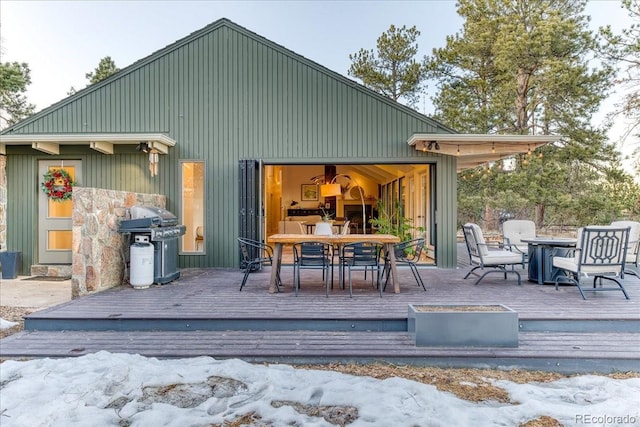 exterior space with outdoor dining area and grilling area