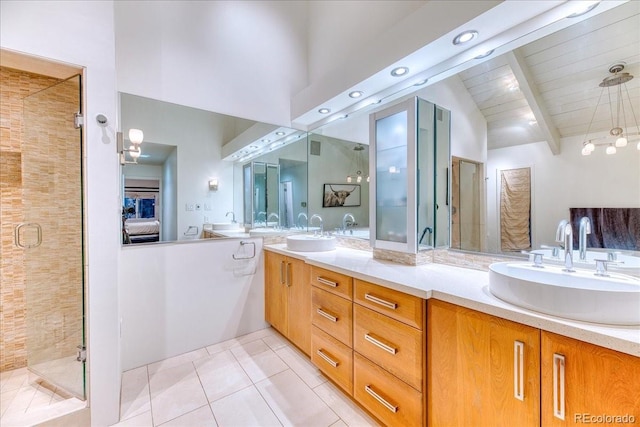 full bath featuring tile patterned flooring, a sink, a shower stall, and beamed ceiling