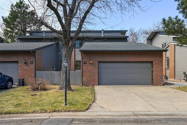 2609 S Quebec St S Unit 20, Denver, CO 80231 - mid-century inspired home with brick siding, a shingled roof, driveway, and an attached garage