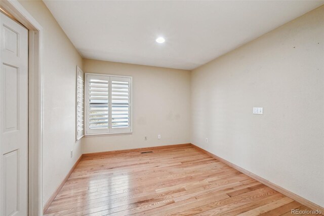 2609 S Quebec St S Unit 20, Denver, CO 80231 - spare room with wood finished floors, baseboards, and recessed lighting