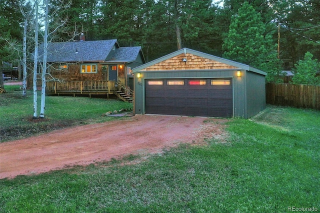 garage with driveway and fence