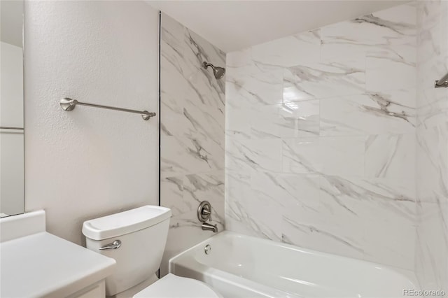 full bathroom featuring vanity, toilet, and tiled shower / bath