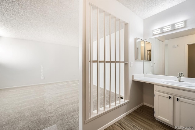 bathroom with vanity and a textured ceiling