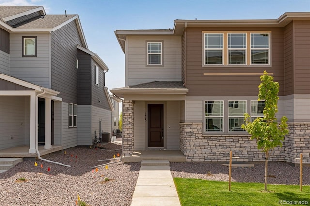 1415 Great Western Dr, Longmont, CO 80501 - view of front of property featuring stone siding and cooling unit