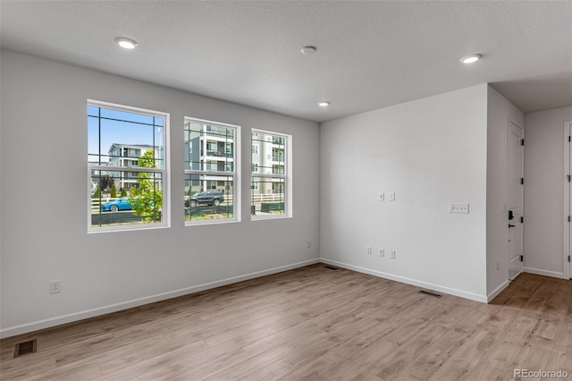 1415 Great Western Dr, Longmont, CO 80501 - spare room with light wood-type flooring, baseboards, and recessed lighting