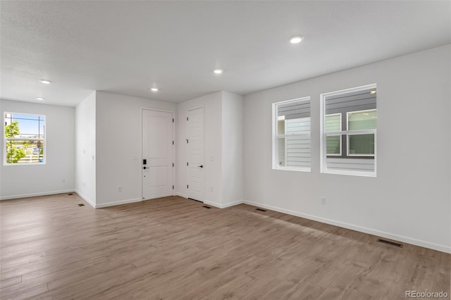 1415 Great Western Dr, Longmont, CO 80501 - empty room featuring baseboards, light wood-style floors, and recessed lighting